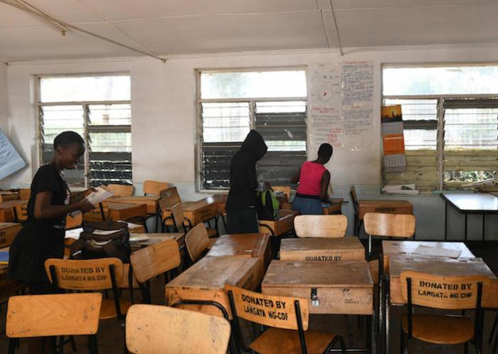 On 16 March 2020, in Nairobi, Kenya, school children pack their books to take home, following a directive by the government suspending learning in all of the country’s educational institutions as a preventive measure against the spread of the coronavirus.