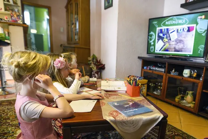 Second-graders Ana and Kaja and their cousin 3-year-old cousin Stela live in North Macedonia, where children have been attending televised classes since March 10, when the government closed schools due to the spread of COVID-19. A daily routine of learnin