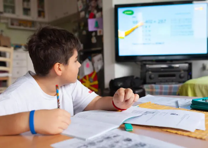 In Skopje, Macedonia, while schools are closed to prevent the spread of the novel coronavirus, 12-year-old Konstantin learns at home by following the TV classroom broadcast on national television, a collaboration with UNICEF and partners. 