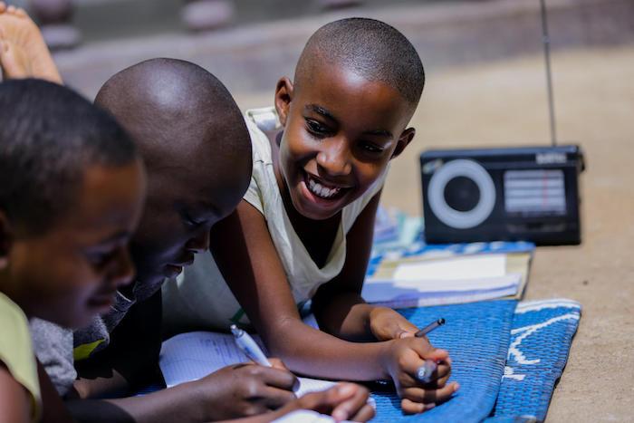 For children in Rwanda, remote learning means listening to lessons broadcast over the radio. 