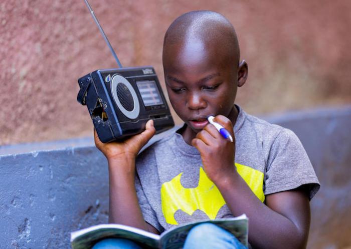 In Rwanda,11-year-old Kevin studies at home due to coronavirus-related school closures, listening to his Primary 5 lessons on the radio every day.
