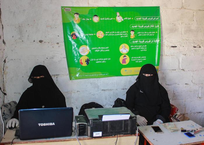 On March 29, 2020, women work at a cash payment distribution site in Sa’ada, Yemen, serving Social Welfare Fund (SWF) beneficiaries. 
