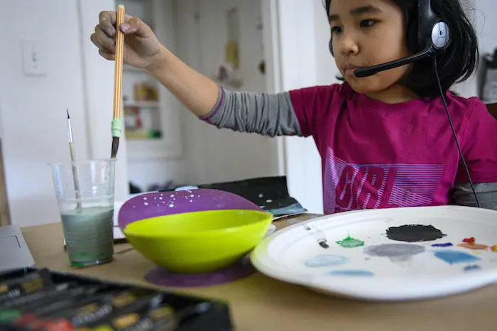 Yolanda, 9, participates in a remote art class from home in New York City.