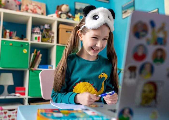On April 15, 2020 in Kyiv, Ukraine, 7-year-old Zlata works on schoolwork from home while schools are closed to prevent the spread of COVID-19.