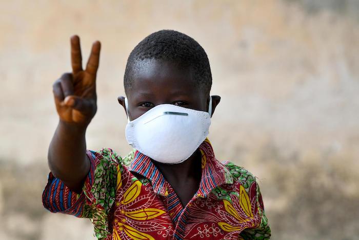 A young boy wearing a mask to protect himself against the coronavirus, in the village of Morovine, in the North of Côte d'Ivoire.