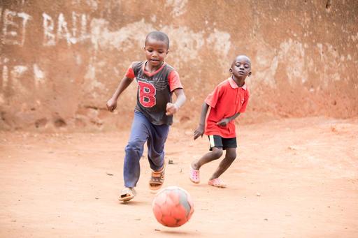 Jonathan, 5, plays soccer with his best friend, Shadrack. During Uganda’s COVID-19 lockdowns, schools close, leaving the country’s kids at loose ends. But throughout the pandemic, playing sports has helped children like Jonathan and Shadrack stay active.