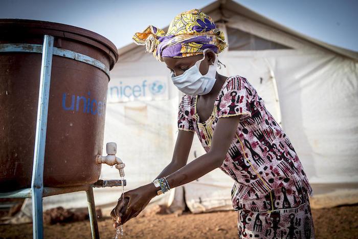 Hamsatou, 13, washes her hands at a camp for displaced families in Mopti, Mali, where UNICEF is helping to improve health and hygiene and communicate best practices for COVID-19 prevention.