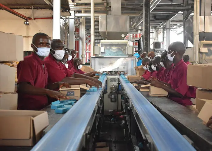 Workers at the Savonor factory in Bujumbura, Burundi, making soap that will be sold at half price to promote handwashing and limit the spread of COVID-19.