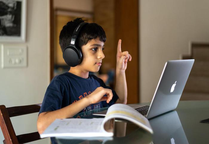 Veer, 10, attends online school during COVID-19 lockdown from his home in India.