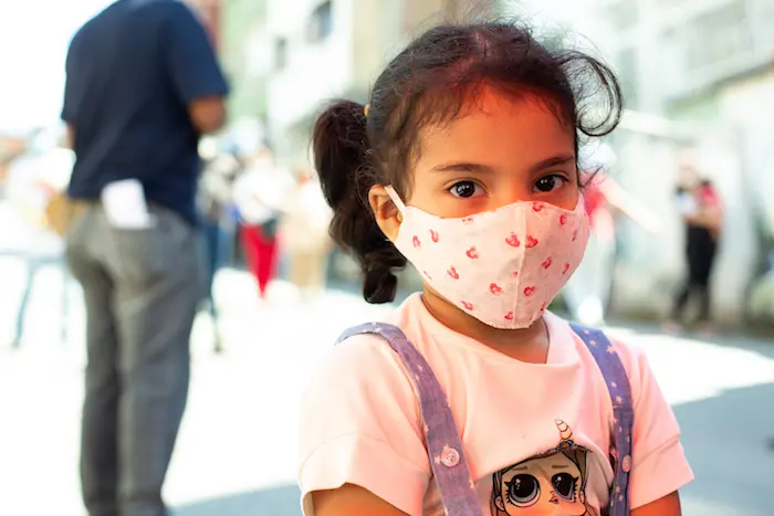 Mariangel García, 5, looks at the camera after being vaccinated against Polio during a vaccination day supported by UNICEF in Catia community located in Caracas, Venezuela on September 09, 2020.
