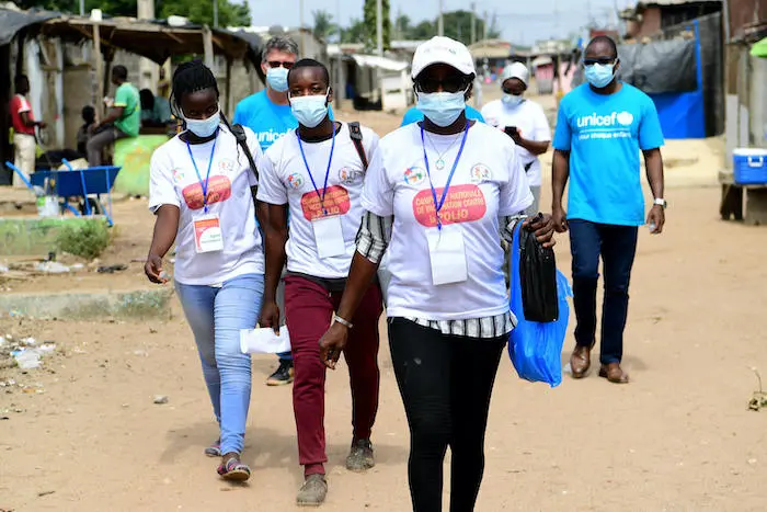 A team of polio vaccinators make the rounds in Gonzagueville, a suburb of Abidjan, Côte d’Ivoire.