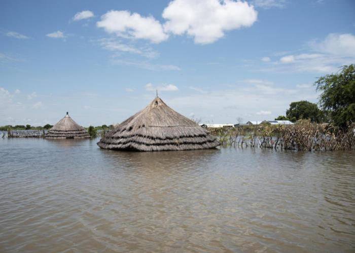 In September 2020, floodwaters in Pibor, South Sudan have swallowed up houses, leaving only their rooftops visible. 