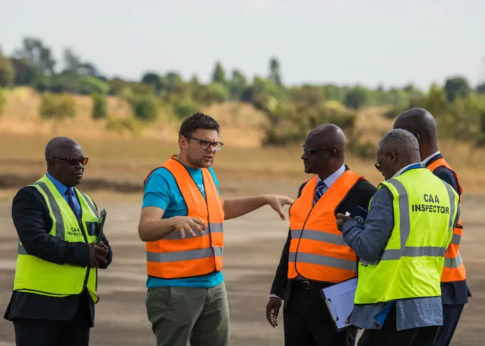 Tautvydas Juskauskas, UNICEF Malawi’s Drone Specialist, with civil aviation officials in Malawi in 2019.