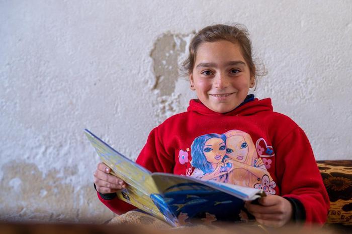 Rasha, 11, at home studying in Safira village, southeastern rural Aleppo, Syria, receives support from UNICEF to helps ensure that her disability does not stand in the way of her dreams..
