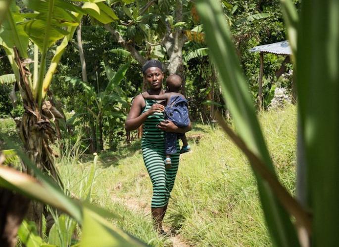Yolette, 34, with her son Jean, near their home in Lasahobas, Haiti, where progress is being made in the fight against cholera. 