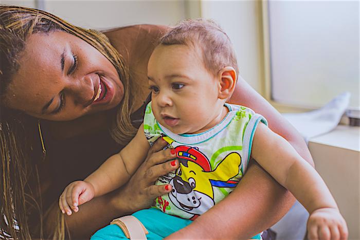 Germana Soares, founder of ‘União de Mães de Anjos’, an organization for Brazilian parents of Zika-affected babies, plays with her 8-month old boy, Guilherme, in a therapy center in Recife, Brazil on August 9, 2016.
