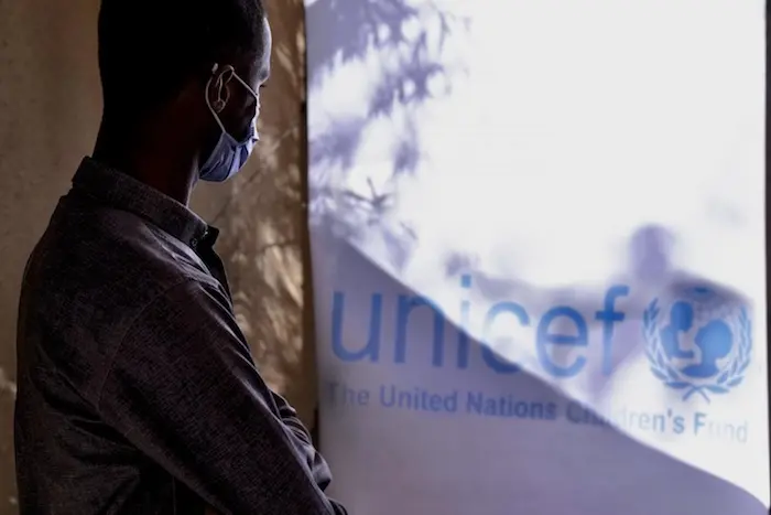 Person Looking at UNICEF sign