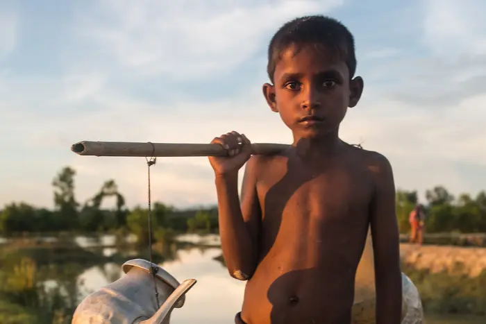 Child Carrying Water