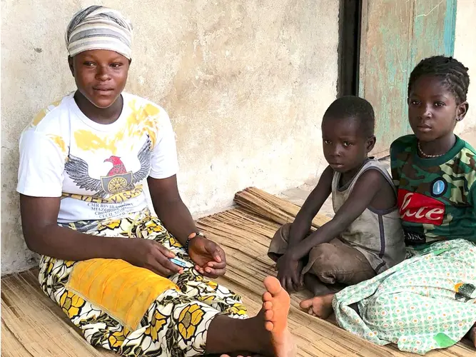 A&iuml;ssata Diaby, who lost her first child to tetanus, with her younger siblings in Tambayah, a village in Guinea.