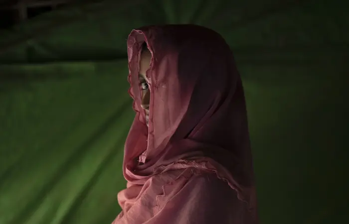 Girl Peering Out from Under Head scarf