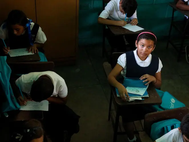 Valeria, 10, goes to a UNICEF-supported school in Maracaibo, Venezuela, where power shortages have forced teachers to shorten the school day.
