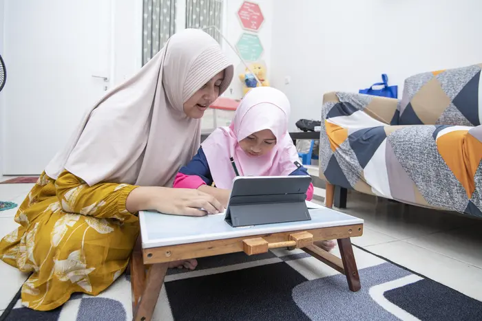 Two Children Using Computer