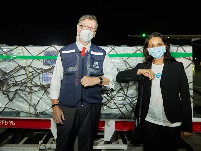 On March 3, 2021, WHO Kenya Representative Rudi Eggers (left) and UNICEF Kenya Representative Maniza Zaman receive the country's first COVID-19 vaccines from the COVAX facility at Jomo Kenyatta International Airport in Nairobi.