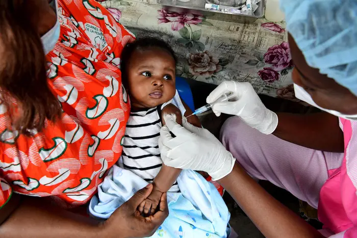 A baby receives a routine vaccination at a UNICEF-supported health center in in Gonzagueville, a suburb of Abidjan, in southern C&ocirc;te d&rsquo;Ivoire.