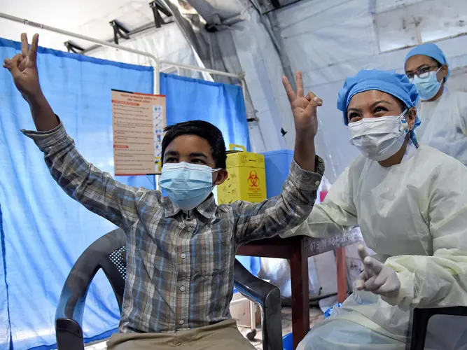 Thirteen-year-old Ashutosh Chhetry received his first dose of COVID-19 vaccine, delivered by UNICEF via COVAX, in Lalitpur District, central Nepal on December 14, 2021.