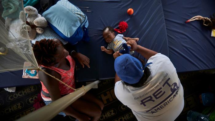 As his mother looks on, an&nbsp;infant receives early stimulation from a psychosocial support specialist with RET Americas, UNICEF implementing partner in Darien.