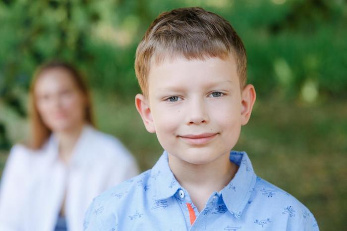 Seven-year-old Pasha smiles during summer camp in Ukraine