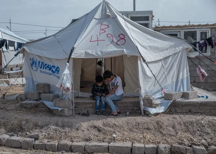 From left: Salam, 5, and Salih, 10, both from Hasakeh, Syria, are part of a wave of refugees arriving in Iraq who are receiving lifesaving assistance from UNICEF and partners. 