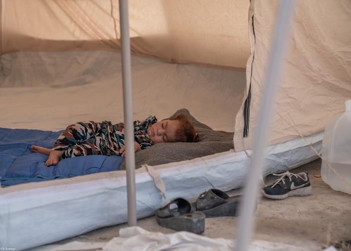 Darya, 2, from Qamishli, Syria, sleeps alone in a tent in the Barderash refugee camp in Akre, Iraq on October 21, 2019.
