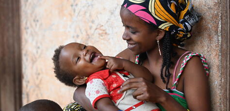 In Bertoua, eastern Cameroon, 23-year-old Houreratou Abdoulay cuddles her youngest child Awaou.