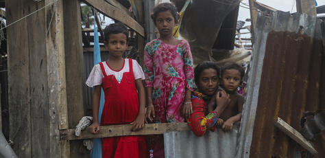 Taieba, 8, Mim, 8, Jannatul, 13, and Shahadat, 3, stand among what remains of their home in Patuakhali, Bangladesh, which was destroyed by Cyclone Remal.