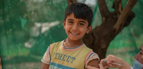 On April 22, 2024, Rayyan receives an MMR vaccine from a UNICEF-supported health worker in the informal tented settlement in Jarish, north Jordan where he lives. 