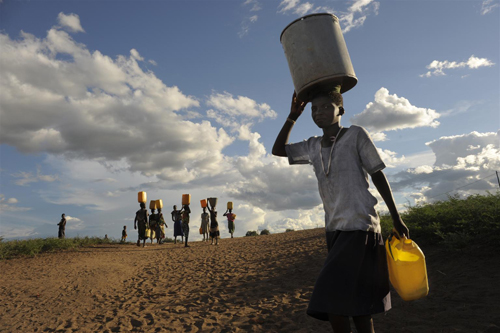 Girls Carrying Water